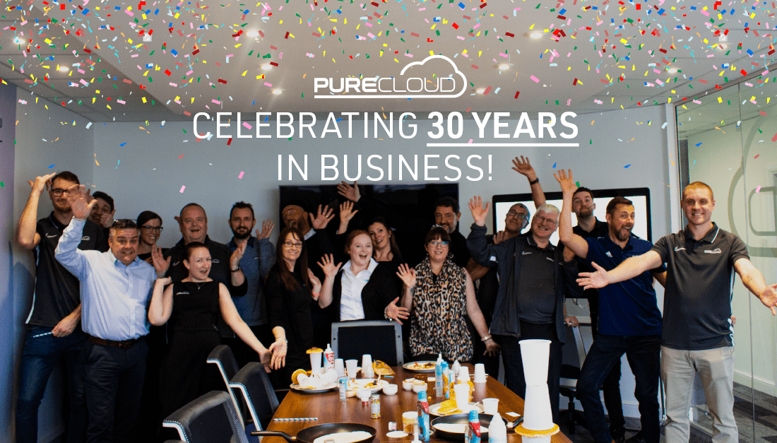 Photo of the Pure Cloud team celebrating 30 years of businesses!