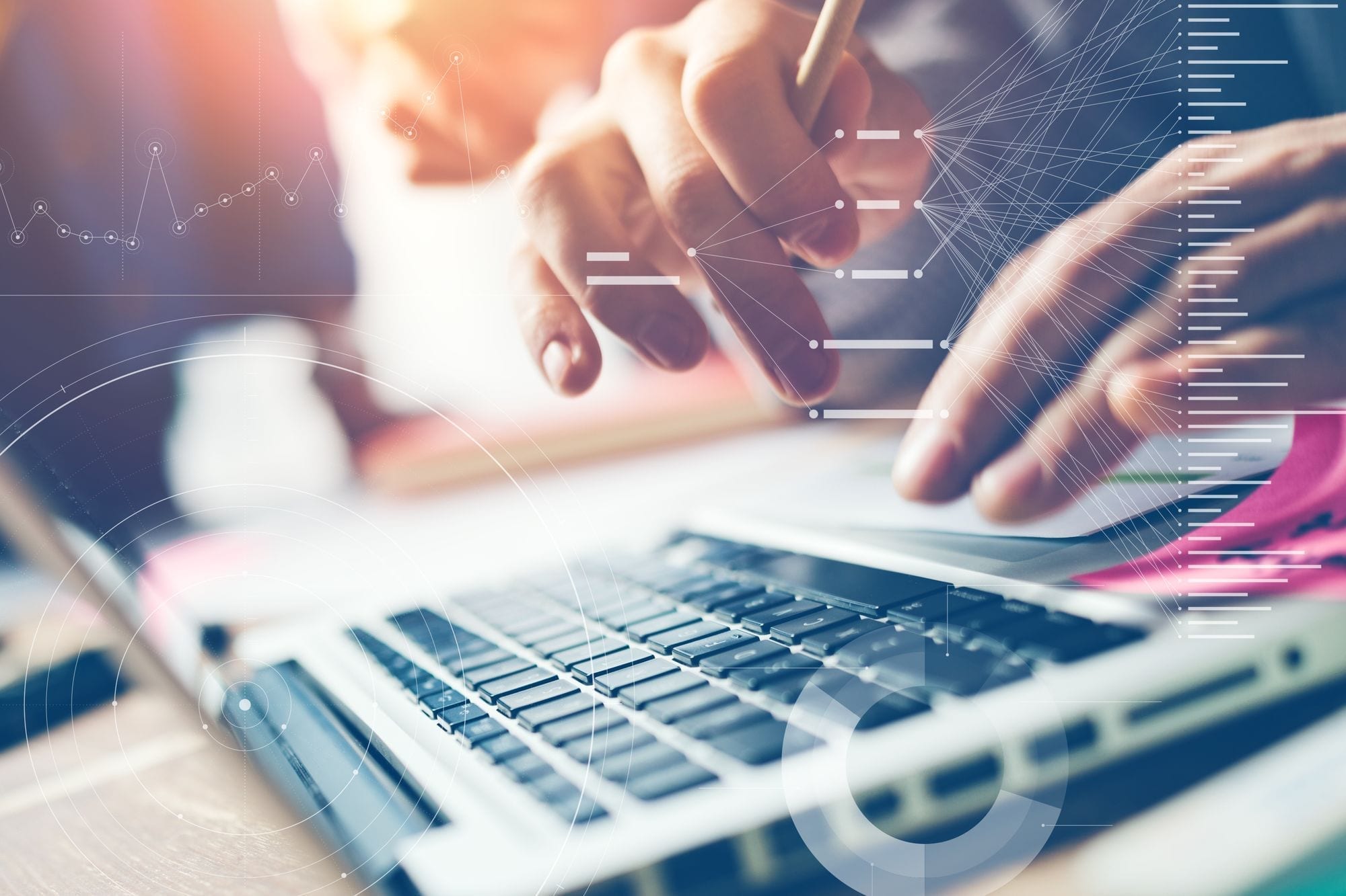 Close-up of hands poised to type on a laptop